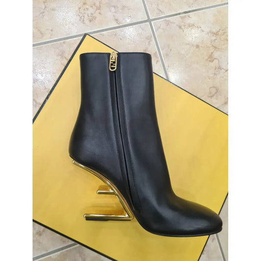 Diagonal F-shaped high heel in gold metal Boots